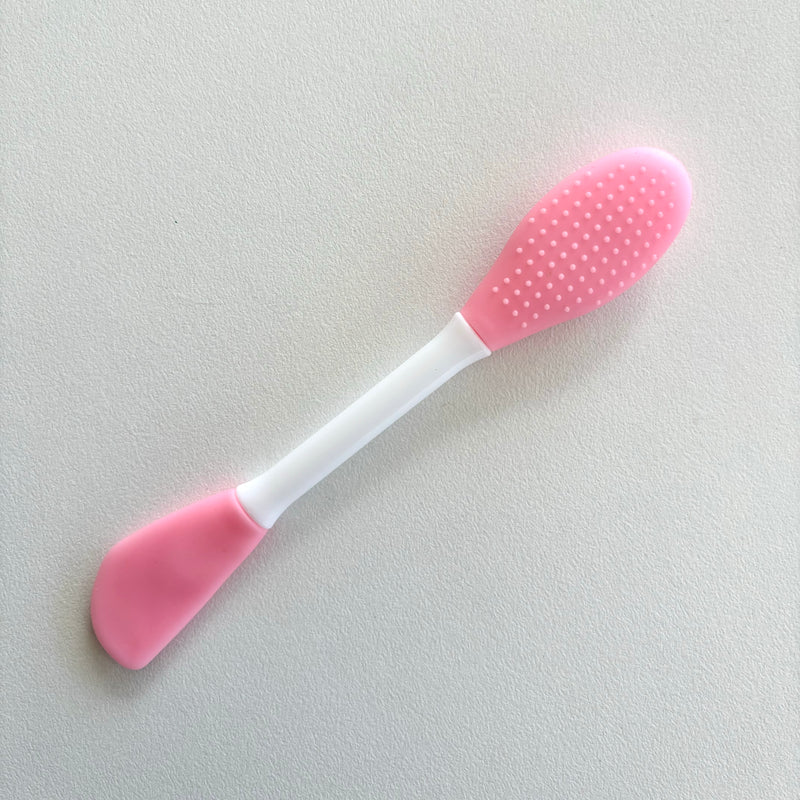 Double sided face brush